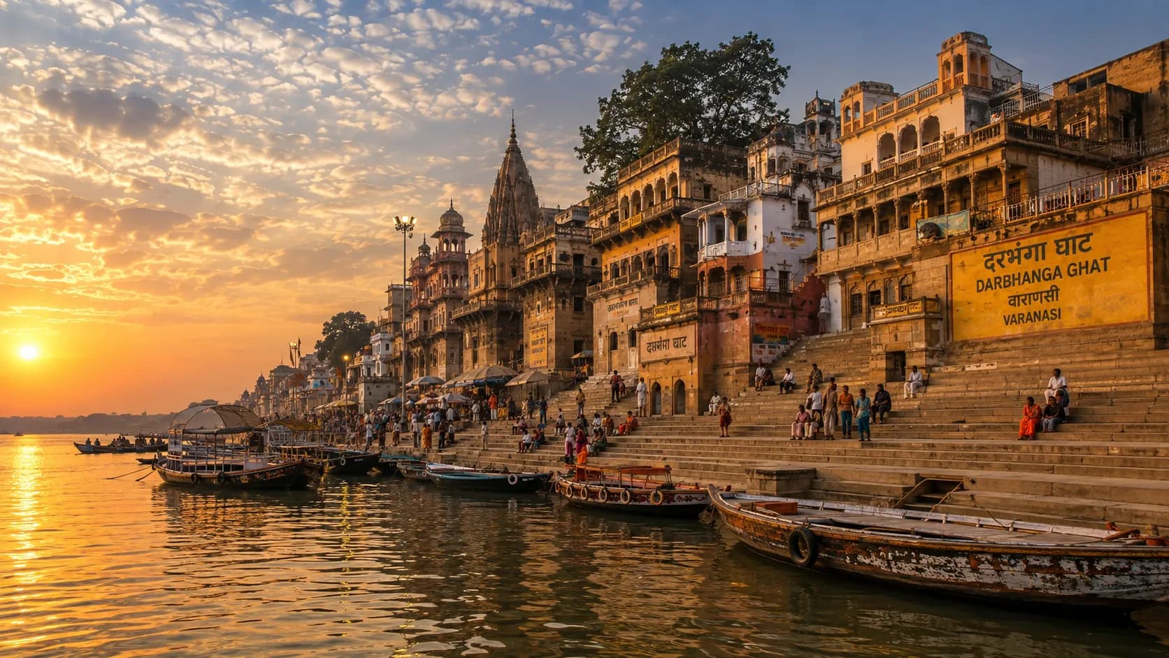Darbhanga Ghat Varanasi - The grand sandstone facade of the Darbhanga palace rising above the ghat from the river at golden light